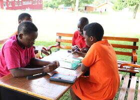 Students enjoying some of the board games in a created safe space at school