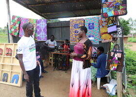 Mr. Agaba David of MHU pays a visit to one the beneficiaries' workshop